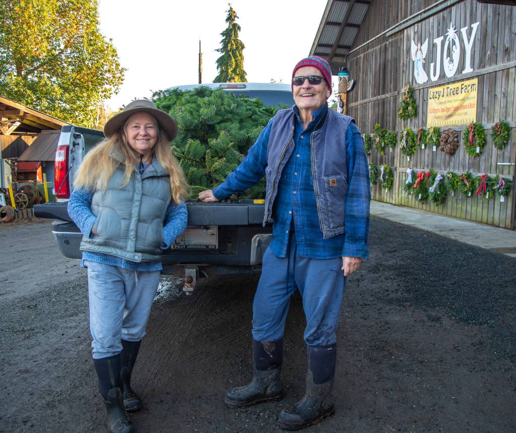 Ive been getting my tree here for 40 years, says Gerald Wood, with his wife Robbin. Wood says they always get Noble firs because of the spacing of the branches. The same size of tree starts getting heavier and heavier over the years, he says with a laugh. (Emily Matthiessen/Olympic Peninsula News Group)
