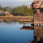 Graham Johnson turns over compost at the Lazy J Tree Farm. (Emily Matthiessen/Olympic Peninsula News Group)