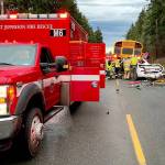 A 40-year-old Quilcene man died and a 7-year-old boy was airlifted to a Seattle hospital after the car in which they were riding collided with the back of a school bus on Center Road on Friday morning. (East Jefferson Fire Rescue)