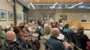 Residents of various manufactured home parks applaud the Sequim City Councils decision on Dec. 9 to approve a new overlay that preserves manufactured home parks so that they cannot be redeveloped for other uses. (Matthew Nash/Olympic Peninsula News Group)