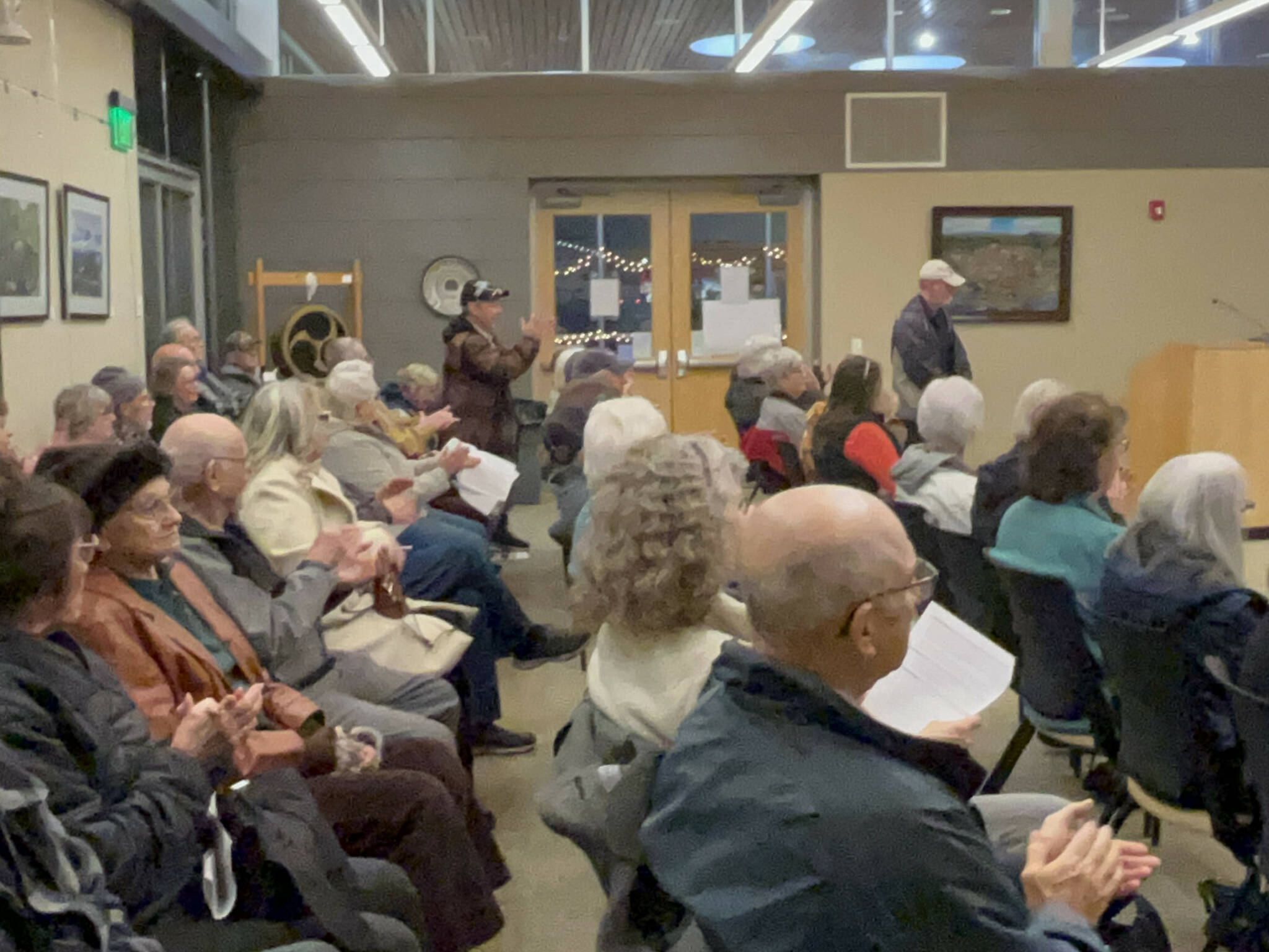 Residents of various manufactured home parks applaud the Sequim City Councils decision on Dec. 9 to approve a new overlay that preserves manufactured home parks so that they cannot be redeveloped for other uses. (Matthew Nash/Olympic Peninsula News Group)