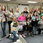 Photos by Katie Salmon

 

Cutline: Just look at those smiling and happy faces of the Neon Riders 4-H horse group as they hold up their completed community service projects — care packages filled with personal hygiene items (toothpaste/brushes/shampoo) along with snacks, colored markers and coloring books for children — they gave to organizations helping recently displaced families