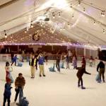 Skaters glide across the Winter Ice Village on Front Street in downtown Port Angeles. The Winter Ice Village, operated by the Port Angeles Chamber of Commerce, is open daily from noon to 9 p.m. through Jan. 5. (Dave Logan/for Peninsula Daily News)