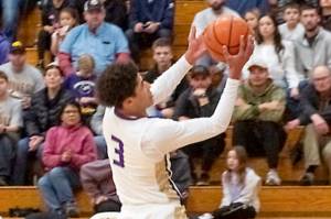 Sequims Solomon Sheppard goes up for a basket against W.F. West on Saturday. Sheppard had 11 points, two slam dunks, a 3-pointer and a blocked shot all in the first quarter, as the Wolves won to improve to 6-0. (Emily Matthiessen/Olympic Peninsula News Group)