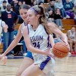 Sequim's Hailey Wagner drives against Bellerine Select, a team from outside of Melbourne, Australia, on Monday in Sequim. Wagner had nine rebounds as Sequim played the Australians tough in a 54-52 loss. (Emily Matthiessen/Olympic Peninsula News Group)