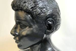 Young Woman, a pottery bust by Janet Piccola is on exhibit during the First Friday Art walk