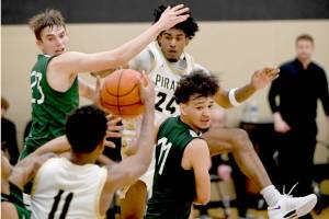 Peninsula College's Jaiden Blackmon (24) looks for the ball from teammate Antonio Odum (11). Blackmon led the shorthanded Pirates in scoring in two straight games this weekend. (Rick Ross/Peninsula College)