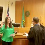 Clallam County Superior Court Judge Elizabeth Stanley is sworn in by Judge Simon Barnhart on Thursday at the Clallam County Courthouse. Stanley, elected in November to Position 1, takes the role left by Judge Lauren Erickson, who retired. Barnhart and Judge Brent Basden also were elected in November. All three ran unopposed. (Dave Logan/for Peninsula Daily News)