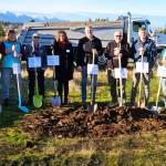 Stakeholders and community leaders stand together for the ceremonial groundbreaking of Habitat for Humanity of Clallam County's Lyon's Landing property in Carlsborg on Dec. 23. (Habitat for Humanity of Clallam County)
