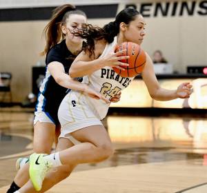 Photos by Jay Cline/Peninsula College
Peninsula Colleges Shania Moananu (24) drives past the defense of an Edmonds player Saturday in Port Angeles. Peninsula won 87-59 to improve to 11-2 on the season.