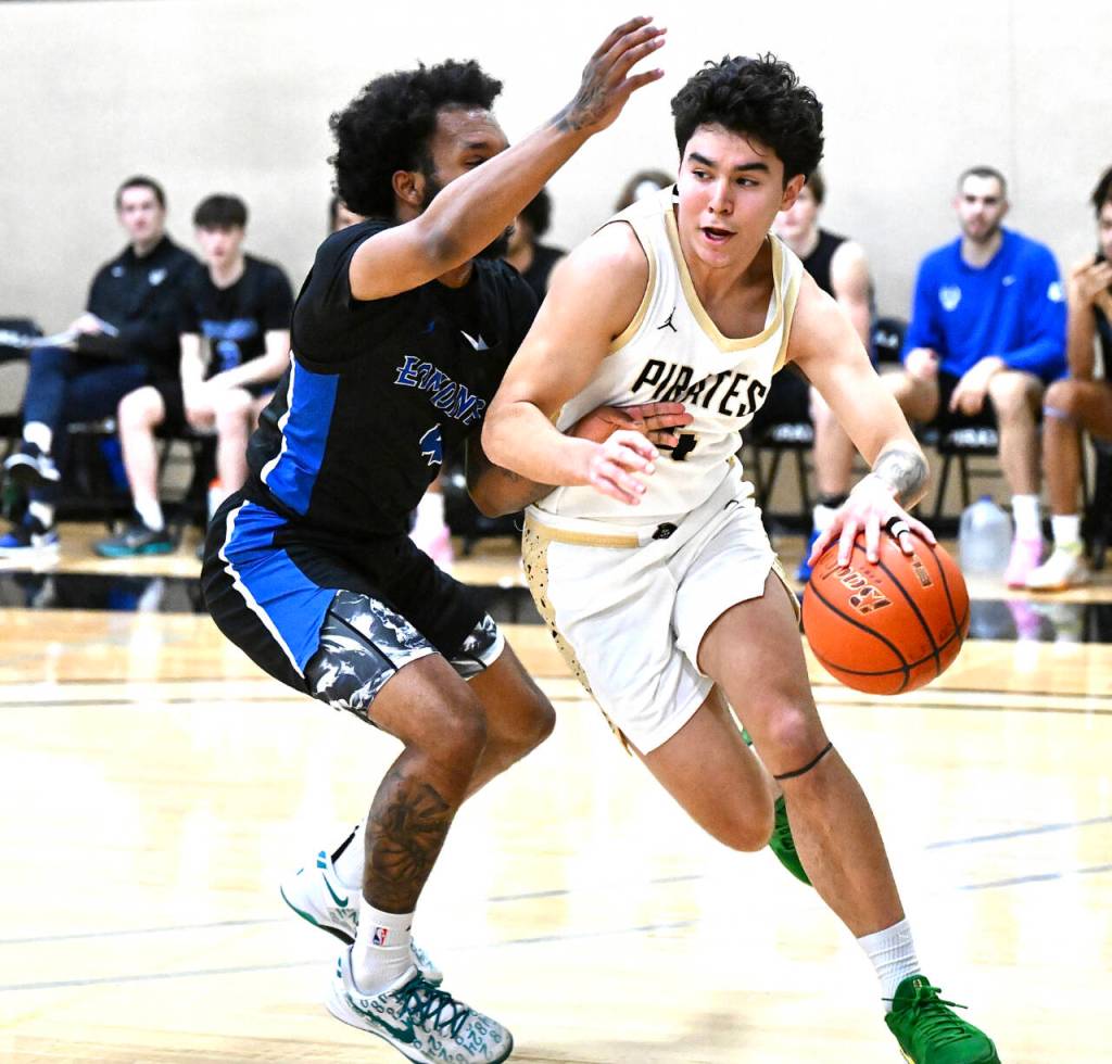 Peninsula College Isaiah Lopez drives against Edmonds on Saturday. Lopez led the Pirates with 27 points as the Peninsula men lost 110-91. (Jay Cline/Peninsula College)