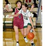 Port Angeles' Morgan Politika drives down the court against the defense of Kingston's Chihiro Yanase on Tuesday in Port Angeles. (Dave Logan/for Peninsula Daily News)