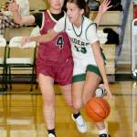 Port Angeles Morgan Politika drives down the court against the defense of Kingstons Chihiro Yanase on Tuesday in Port Angeles. (Dave Logan/for Peninsula Daily News)