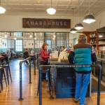 Holly Hildreth of Port Townsend, center, orders a latte for the last time at the Guardhouse, a cafe at Fort Worden State Park, on Wednesday. At noon the popular cafe was to close permanently, leaving an empty space for food, drinks and restroom facilities in the park. (Steve Mullensky/for Peninsula Daily News)