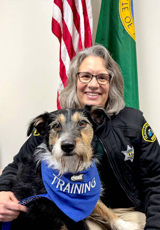 Chaplain Kathi Gregoire poses with Scout, her 4-year-old mixed breed dog. Scout is training to be a therapy dog to join Gregoire on future community calls with either the Clallam County Sheriffs Office or the Washington State Patrol. (Clallam County Sheriffs Office)