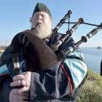 Erik Evans of Port Angeles, known as the Parking Lot Piper, performs on Tuesday at Sail and Paddle Park on Ediz Hook in Port Angeles. Evans often gives a free lunchtime concert on bagpipes at various locations in the Port Angeles area. (Keith Thorpe/Peninsula Daily News)