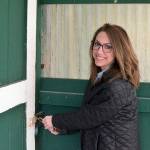Executive Director Karly Mishko opens the Horticulture Building at Jefferson County Fairgrounds on Thursday. (Elijah Sussman/Peninsula Daily News)