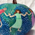 Jane Smith uses gourds as her canvas. She uses a wide variety of techniques and embellishments in her designs, and the trinkets she uses to enhance her work come from her lifetime of collecting.