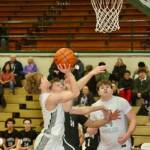 Dave Logan/for Peninsula Daily News Port Angeles post Brock Hope, right, eyes the basket as teammate Gus Halberg attempts a shot during the Roughriders win over North Kitsap on Tuesday at the Rider Gym.