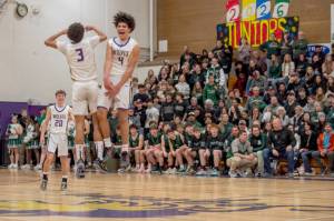Emily Matthiessen/Olympic Peninsula News Group
Sequim's Jericho Julmist, right, and Solomon Sheppard celebrate the Wolves' come-from-behind victory over rival Port Angeles on Friday night.