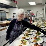 Kathy Cruz/Olympic Peninsula News Group
Mary Montgomery-Crumley dishes up helpings of salad at Soups On. Lunch also included a biscuit, two versions of minestrone soup, one vegetarian, one with chicken, and chocolate chip butterscotch bars.