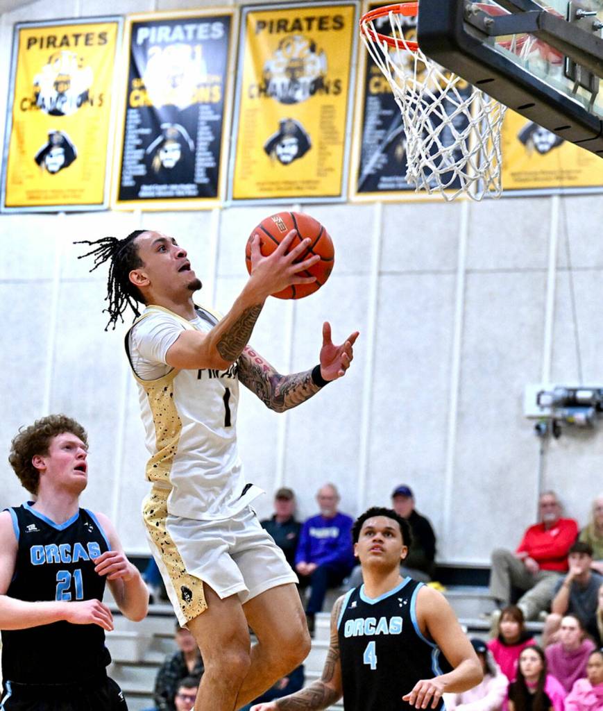 Jay Cline/Peninsula College Athletics Peninsula Colleges DeShawn Rushmeyer rises for a layup during the Pirates 97-74 NWAC North Region mens basketball victory Wednesday night.