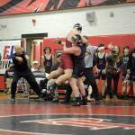 Mason Iverson, right, lifts Kingston's Jack Grady before earning a pin during East Jefferson's home tournament in December. Wrestling for the Port Townsend-based team, Iverson became the first Quilcene student to qualify for Mat Classic, the state wrestling meet, earlier this week.  