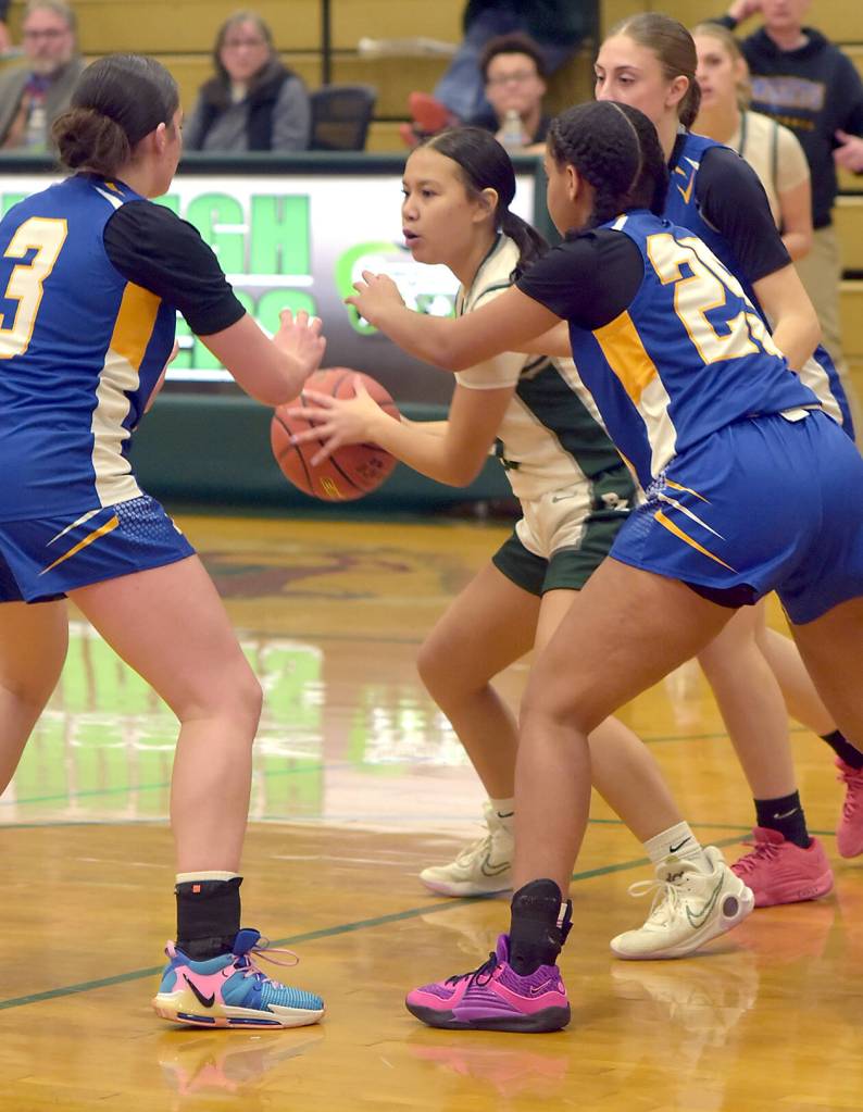 KEITH THORPE/PENINSULA DAILY NEWS
Port Angeles' Tatum Moses, center, is surrounded by Bremerton defenders, from left, Tiana Barber, Eulahn King and Siara Wilson on Friday at Port Angeles High School.
