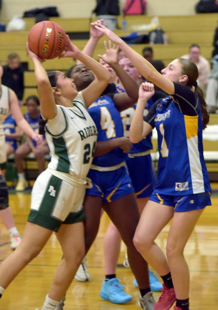 KEITH THORPE/PENINSULA DAILY NEWS Port Angeles Kenzie Moses, left, tries to avoid Bremerton defenders, from left, Nikaya Harper-Bright, Rylee Wheaton and McKaela Robison on Friday in Port Angeles.