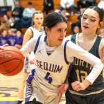 Sequims Gracie Chartraw dribbles against North Kitsap on Friday in the Wolves final home game of the year. (Emily Mathiessen/Olympic Peninsula News Group)