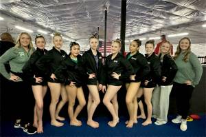 The Port Angeles and Sequim gymnastics teams competed at the District 3 meet this weekend. From left are head coach Elizabeth DeFrang, Lillian Sutherland, Lexi Possinger, Denise Galvan, Amelie Martin (Sequim), Lucy Spelker (Sequim), Shavari Epps, Ryah Deleon, Mya Callie and assistant coach Laura Rooney.