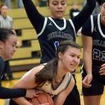 KEITH THORPE/PENINSULA DAILY NEWS
Port Angeles' Lindsay Smith, center, holds onto the ball surrounded by North Mason defenders, from left, Adrianna Tupolo, Adrianne Tupolo and Briana Cauhtenango on Tuesday's playoff game in Port Angeles.