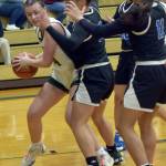 KEITH THORPE/PENINSULA DAILY NEWS Port Angeles Lexie Smith, left, is blockaded in the lane by, from center left, North Masons Adrianna Tupolo, Adrianne Tupolo and Natalya Garcia on Tuesday at Port Angeles High School.