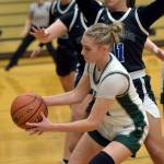 KEITH THORPE/PENINSULA DAILY NEWS Teanna Clark of Port Angeles, front, receives a pass as North Masons Natalya Garcia puts up a block on Tuesday evening in Port Angeles.