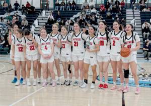 Neah Bay Red Devils 
The Neah Bay Red Devils celebrate their Tri-District tournament championship Saturday night in Auburn. Neah Bay goes to state looking to win its third straight state championship. From left, are, Cerise Moss, Kandi McGimpsey (12), Destiny Lawrence (22), Brianna McGimpsey (4), Trinity Johnson, Danica Halttunen (13), Wiinuk Martin (21), Qwaapeys Greene (15), Lillie Yallup (10), Angel Halttunen (2) and Caylee Moss (11). Obscured is Tisalee Ramos.