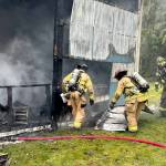 East Jefferson Fire Rescue firefighters work to extinguish a structure fire on Tuesday near the intersection of Lupine and South Jacob Miller roads. (East Jefferson Fire Rescue)