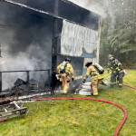 East Jefferson Fire Rescue firefighters work to extinguish a structure fire on Tuesday near the intersection of Lupine and South Jacob Miller roads. (East Jefferson Fire Rescue)