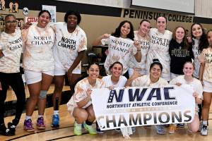 Jay Cline/Peninsula College Athletics 
The Peninsula College women's basketball team and head coach Alison Crumb celebrate its fourth straight NWAC North Division championship, and eighth league title in program history.