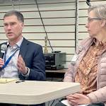 Olympic Medical Center CEO Darryl Wolfe, left, and board President Ann Henninger present information and answer questions about the hospitals exploration of a possible partnership with another health care system at a forum held by the Clallam County Democrats. Aligning with another organization could help address OMCs financial challenges and meet community care needs, Wolfe said. (Paula Hunt/Peninsula Daily News)
