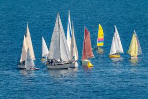 Sailboats jam up going around the first mark during a race on Port Townsend Bay on Saturday. After being delayed a week due to stormy weather, 30 boats took to the calmer waters of Port Townsend Bay for the 34th Shipwrights Regatta hosted by the Port Townsend Sailing Association. (Steve Mullensky/for Peninsula Daily News)