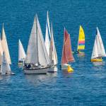Sailboats jam up going around the first mark during a race on Port Townsend Bay on Saturday. After being delayed a week due to stormy weather, 30 boats took to the calmer waters of Port Townsend Bay for the 34th Shipwrights Regatta hosted by the Port Townsend Sailing Association. (Steve Mullensky/for Peninsula Daily News)