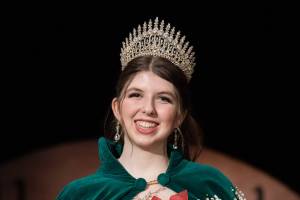 The 130th Irrigation Festivals queen, Lily Tjemsland, receives her crown after participating in the scholarship pageant, which included a monologue performance, a dance routine with her fellow contestants and answering questions, both on stage and off. (Emily Matthiessen/Olympic Peninsula News Group)