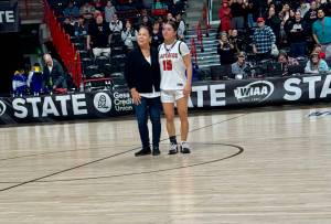 Courtesy Bud Denney 
Neah Bays Qwaapeys Greene, right, received the WIAA Sportsmanship Medallion from Lauri McCaulley for her play in the Red Devils 51-36 state quarterfinal win over Oakesdale on Thursday at the Spokane Arena.