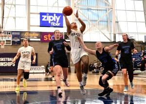 Jay Cline/Peninsula College Athletics 
Peninsula Colleges Ciera Tugade Agasiva cuts through the South Puget Sound defense and gets to the rim for a layup during the Pirates NWAC womens basketball tournament Elite 8 victory Thursday at Columbia Basin College in Pasco.