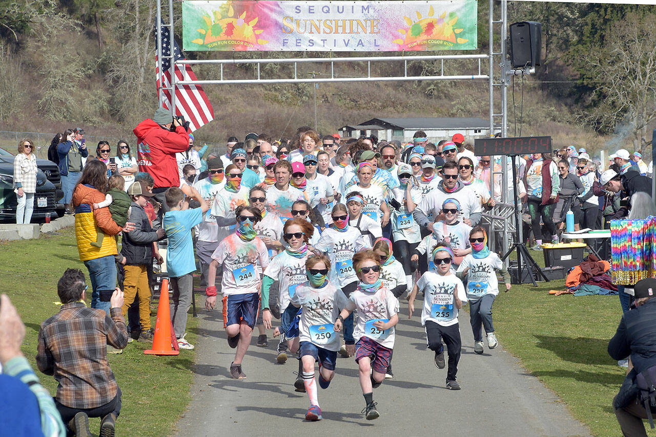 Participants in the Sequim Sunshine Festival Sun Fun Color Run take off from the starting line on Saturday at the Albert Haller Play Fields near Carrie Blake Park. The two-day festival featured numerous activities, food, music and a drone show on Saturday night. (Keith Thorpe/Peninsula Daily News)