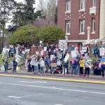 Part of a crowd of nearly 200 people gathers in front of the Clallam County Courthouse in Port Angeles on Saturday for International Womens Day. The gathering was one of numerous events around the world honoring women and their contributions to global society. (Keith Thorpe/Peninsula Daily News)