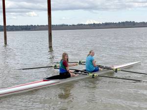 From left, Mariah Disque and Kadence Greul of the Olympic Peninsula Rowing Club competed in the women’s Jr. U17 doubles boat at Vancouver Lake this weekend. (OPRA)