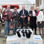 L-R Susan Hillgren, Director of The Answer for Youth, Rotarians Steve Zenovic and Jason Grice working on a project at TAFY along with Bill Koenig, Rotarian and General Manager of Koenig Subaru, Alma Meyrick, Koenig Subaru and Vivian Hansen, Peninsula Daily News.