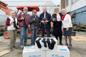 L-R Susan Hillgren, Director of The Answer for Youth, Rotarians Steve Zenovic and Jason Grice working on a project at TAFY along with Bill Koenig, Rotarian and General Manager of Koenig Subaru, Alma Meyrick, Koenig Subaru and Vivian Hansen, Peninsula Daily News.