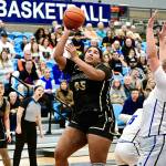 Peninsula College's Jelissa Julmist (Sequim High School) goes up for a basket against Lane in the NWAC semifinals held in Pasco on Saturday. Defending NWAC champion Lane hit 12 3-pointers and won 80-63, the Titans' 45th win in a row as the Pirates' season ends with a 24-3 record. In on the play is Peninsula's Ciera Tugade Agasiva. (Jay Cline/Peninsula College).